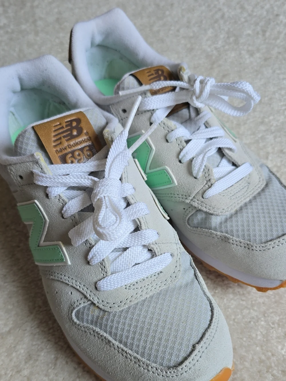 New Balance sneakers in mint green and light gray